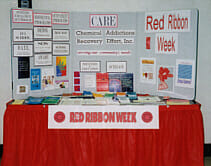 Image of the CARE Red Ribbon Week display table.